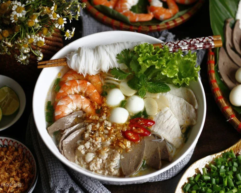The broth of Hu Tieu is simmered from bones, making it naturally sweet and clear.